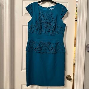 Peplum dress with lace cutouts